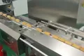 Sistema automático de envasado de snacks apilados