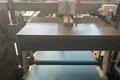 Envasadora horizontal flow pack SF-DH3 con sellado recíproco y alimentación inferior de film