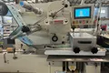 Envasadora horizontal flow pack SF-G sin bandeja con doble canal para galletas en posición vertical
